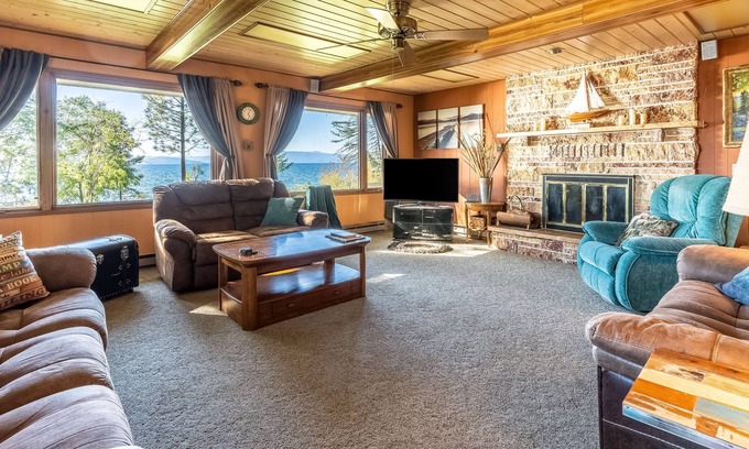 Polson House | Dog-friendly lakefront home & guest house with private beach, dock, & firepit
