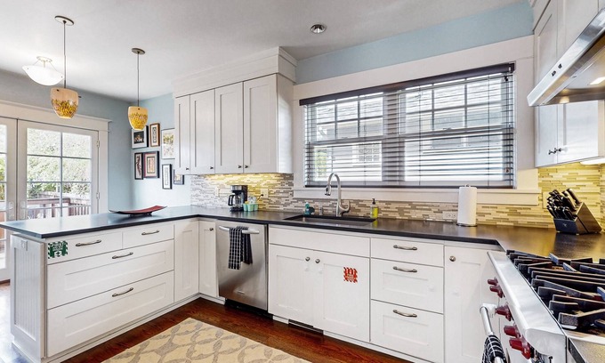 West Woodland House | Dog-friendly spacious retreat with patio, backyard oasis, & W/D - walkable location