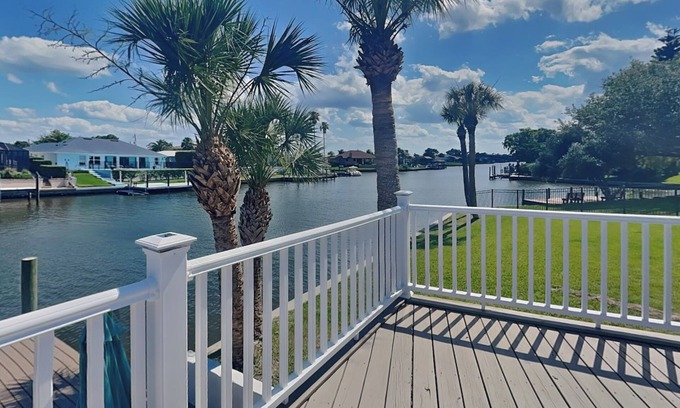 Palm Harbor House | Dolphin View Oasis | Spacious Pet-Friendly Canal-front Home with Game Room+ Dock