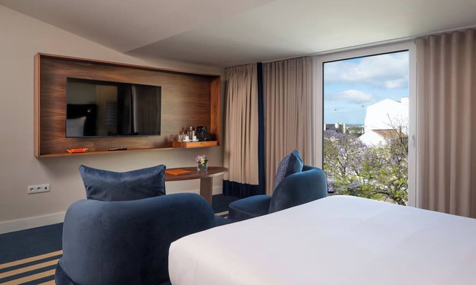 Belem Hotel | Elegant Lisbon Stay with Indoor & Outdoor Pools | Pet-Friendly with Free Parking