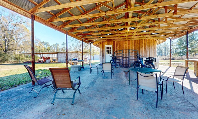 Magnolia House | Expansive property with two homes, ponds, pool, game tables, & hiking trails