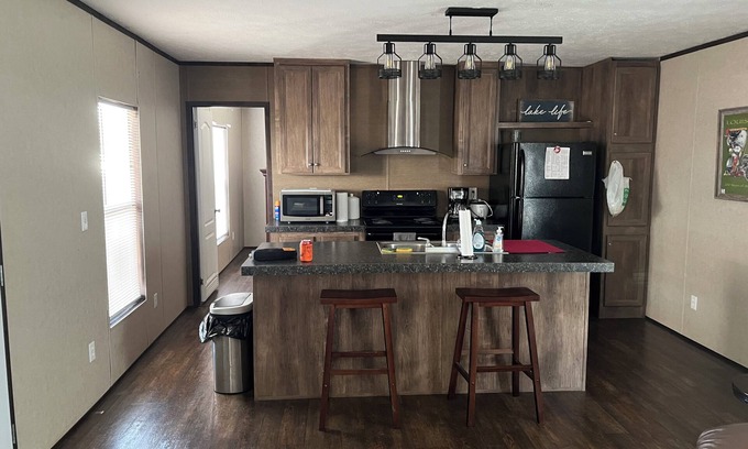 Hackberry House | Fishing camp with boat stall cleaning table three bedroom two bath