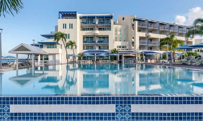 Pelican Key Resort | Flamingo Beach by Hilton: Oceanfront Resort, Pools & Spacious Studios To Relax!