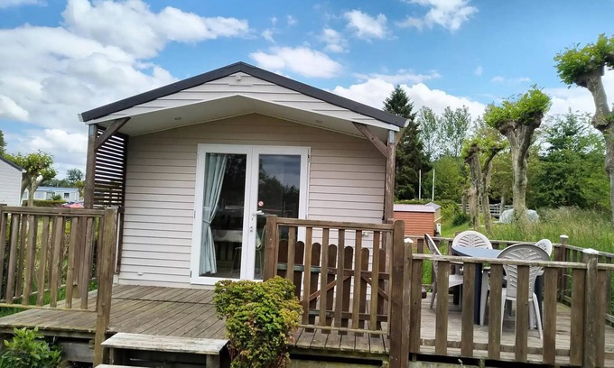 Martigny House | Flower Camping Des 2 Rivières * - Mobile Home Comfort TV - 1 bedroom + semi-covered terrace - 2 to 4 people - 2 people. included in the price