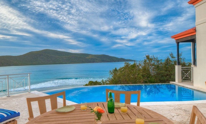 Scrub Island Villa | Four-Bedroom Villa: Luxurious bedrooms and private terraces with ocean views.