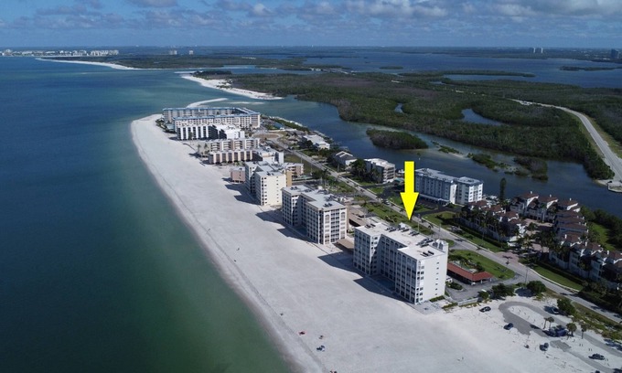 Bonita Springs Condo | Gorgeous Beachfront With Endless Sunsets! Highly Desired Corner Unit! Heated Pool & Free Parking!