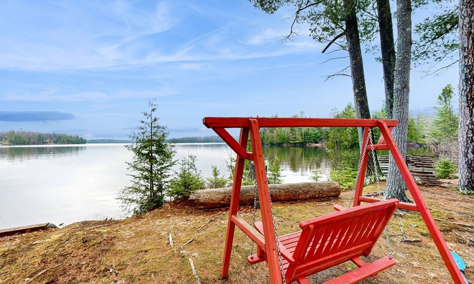 Three Lakes House | Gorgeous lakefront lodge with dock, deck, game room & firepit
