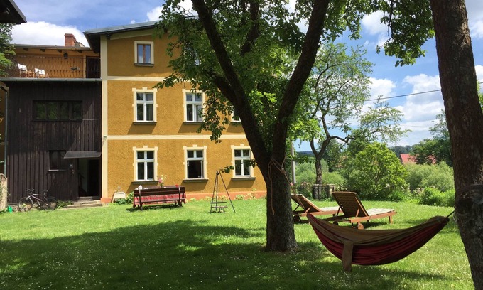 Janowice Wielkie House | Historic holiday home for families and groupsnwith garden and play barn.