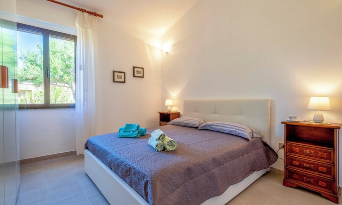 Trinita d'Agultu e Vignola House | Holiday Home 'Rose's House' with Lateral Sea View, Private Terrace and Private Garden