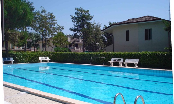 Porto Santa Margherita House | Holiday home with outdoor swimming pool and terrace