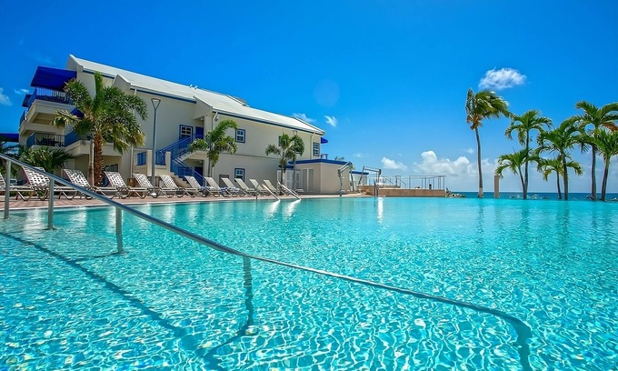 Pelican Key Hotel | Ideal Location! Onsite Pool, Free Parking Onsite, Walk to the Beach