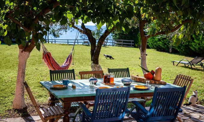 Agios Matthaios House | Idyllically situated and luxurious villa with a veranda and a gazebo