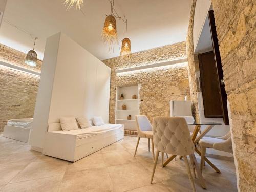Cagliari Apartment | Kalma Villanova - Stone Elegance in the Old Town