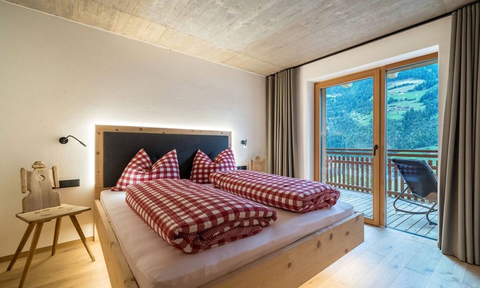 San Martino in Passiria Apartment | LAGAR holiday flat "Pircher Schnallele" with private garden terrace and mountain view