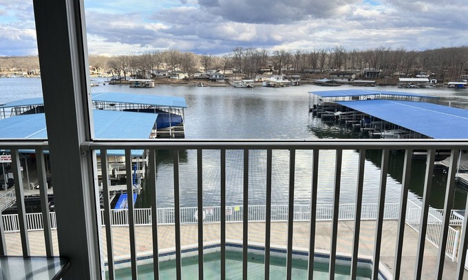 Sunrise Beach Condo | Lake Lodge Condo overlooking The swimming pool and the￼ Lake of the Ozarks