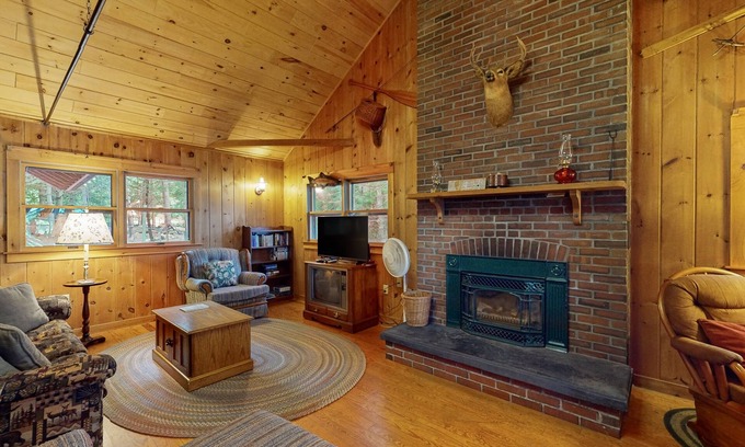 Greenville Junction House | Lakefront Home with Private Dock, Pebble Beach & Enclosed Porch - Dogs Welcome