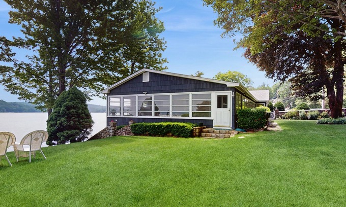 Alton Bay House | Lakeside paradise w/lakefront deck, enclosed porch, 2 docks & large lawn