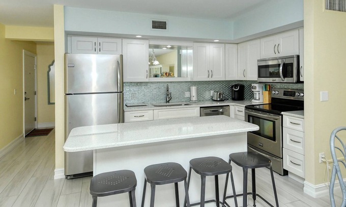 Longboat Key Apartment | LaPlaya 103A-Time to relax! Enjoy the peaceful, private beach just a shell's throw from your door.