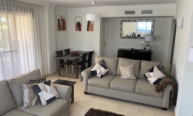 Marbella Apartment | Large High Quality Apartment in Elviria . Large Terrace, Pools and Gardens