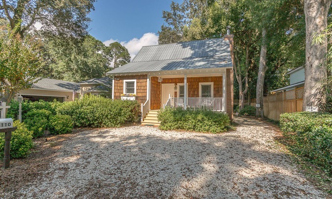 Demere Park House | Little Gingerbread Cabin Two Bedroom Two Bath Home with Rocking Chair Porch