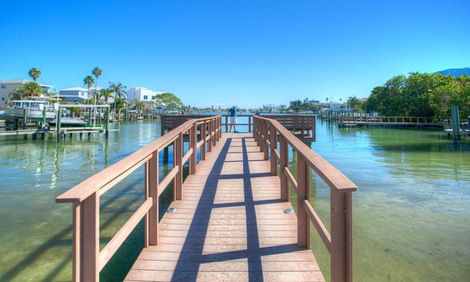 Sunset Beach Condo | Location, Location. Charming Beachside Condo. Pool, Deck Overlooking the Bay.