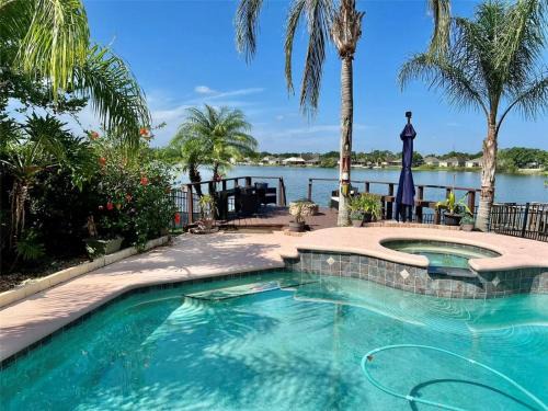 Orlando Villa | Luxurious Waterfront Retreat 4BR 3BA with Pool & BBQ