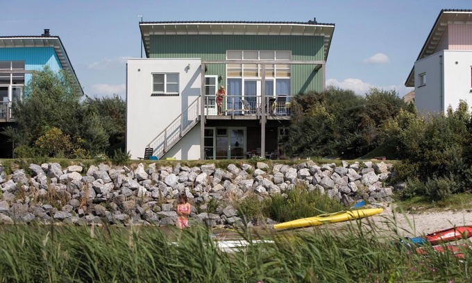 Makkum Cabin | Luxury Beach Villa with balcony, terrace, fireplace, and panoramic IJsselmeer views at Beach Resort Makkum.