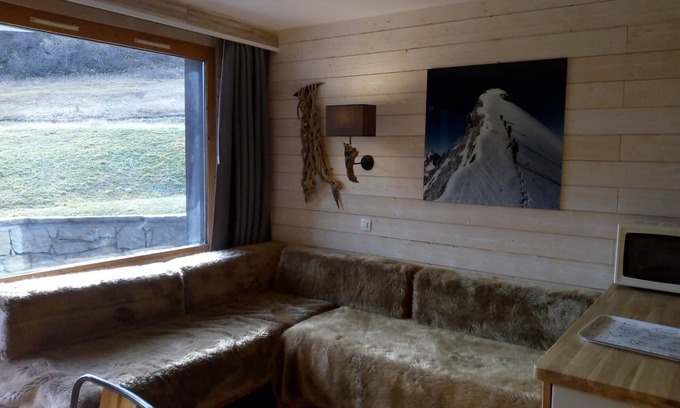 Meribel-Mottaret Apartment | Méribel apartment at the foot of the slopes with balcony, ski locker, and WIFI