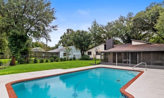 Lakeland House | Midcentury Modern Home with Pool, Theater, & Fire Pit