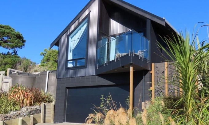 Castlepoint Apartment | Modern apartment with stunning views of Lighthouse and short walk to beach.