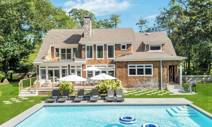 North Haven House | Modern Coastal Farmhouse style home with a private pool, open-floor plan,.