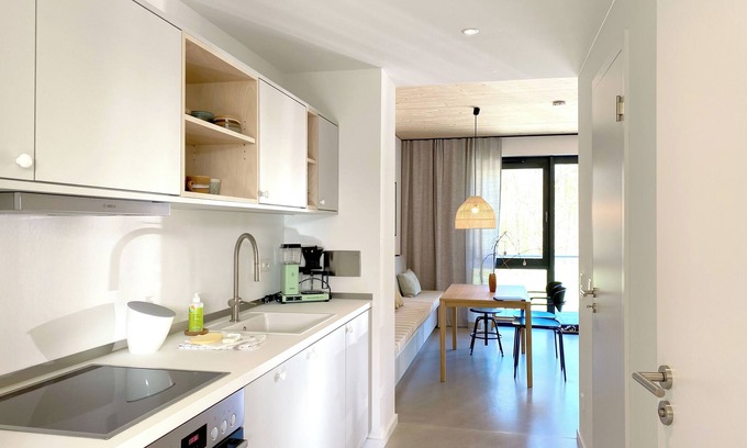 Hohwacht Apartment | Modern duplex apartment with rooftop terrace.