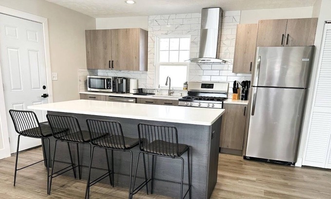 Lincoln House | Modern Home near downtown and UNL with Firepit, BBQ Grill & Air Hockey!