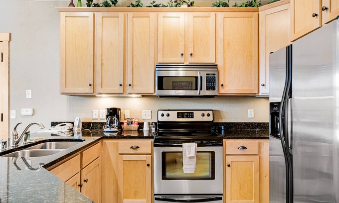 Three Lakes Condo | Modern, lake-view condo with loft, balcony, fireplace, pool & hot tub access