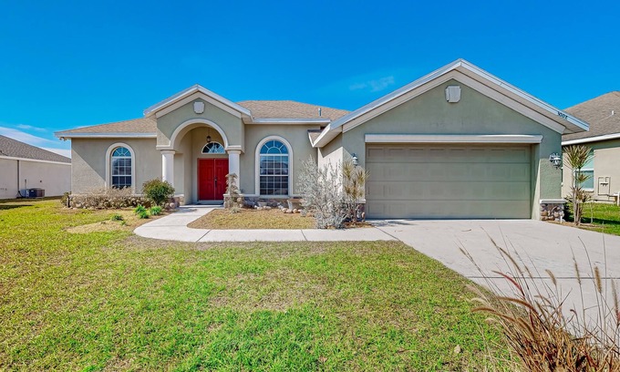 Plant City House | Modernly updated open home with lake view, screened-in patio, grill, AC, & W/D