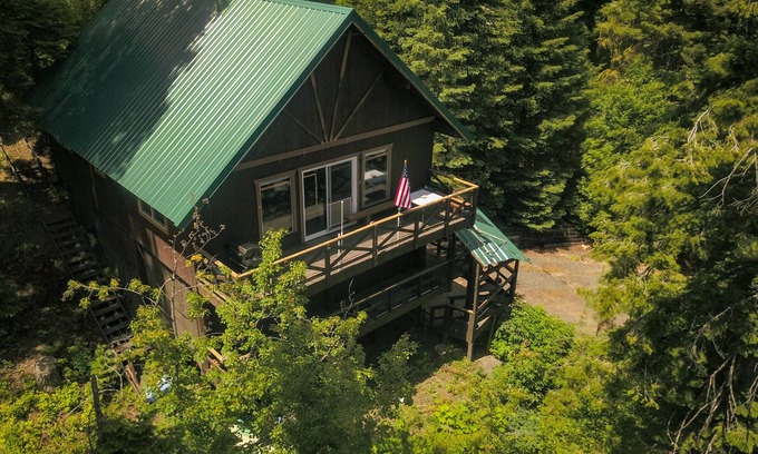 Cascade House | Mountain chalet nestled in the evergreens, peekaboo views of the lake in between