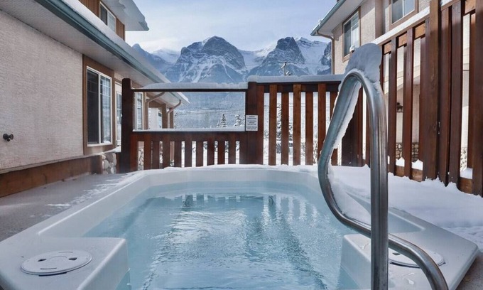 Harvie Heights Condo | Mountain View Family Getaway, Hot Tub, Park Pass