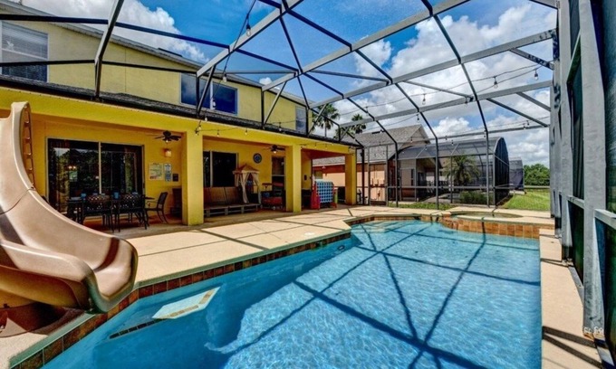 West Kissimmee Villa | NEW! Mickey's Island Escape - 6 Bedroom w/Pool Slide