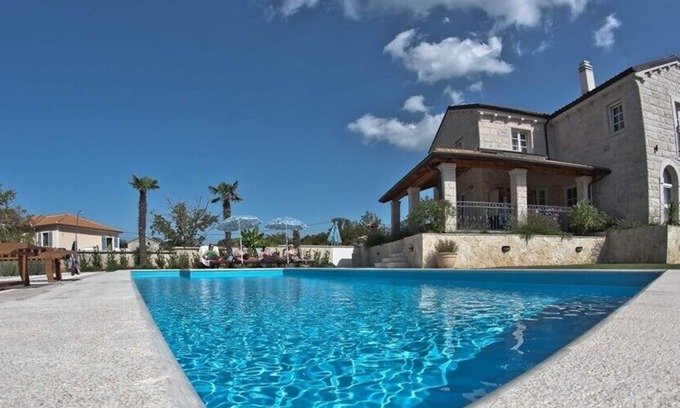 Kras Villa | New natural stone villa 300 m², pool, playground, fitness, sauna & wine cellar