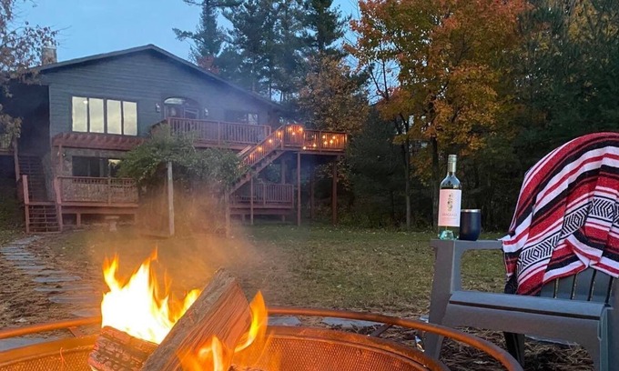 Neillsville House | Newly renovated Lake Side Leisure with boat dock, fire pit, and updated decor in a modern lake home