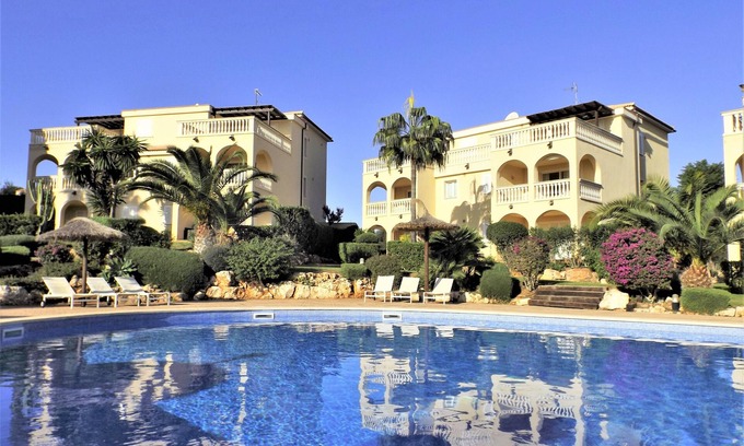 Cala Mandia Apartment | Nice apartment in a quiet residence with a large pool and a beautiful garden