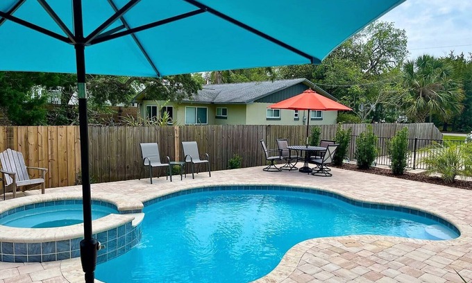 Butler Beach House | Paradise by the River - Relax in Style! New Pool and Heated Spa!