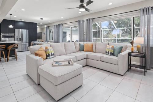 Temple Terrace House | Paradise in Blue is a 5BR Contemporary Modern Screened in Heated Pool Home that Sleeps 12 in Temple Terrace Neighborhood near Busch Gardens & USF