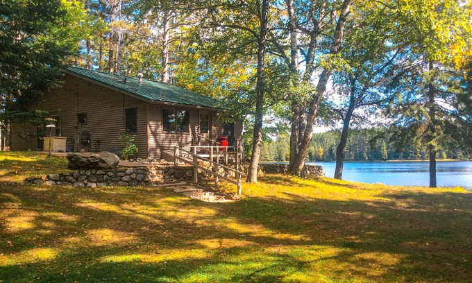 Rhinelander House | Peaceful, quiet lakefront dog-friendly cabin w/fishing dock, boats, campfire pit