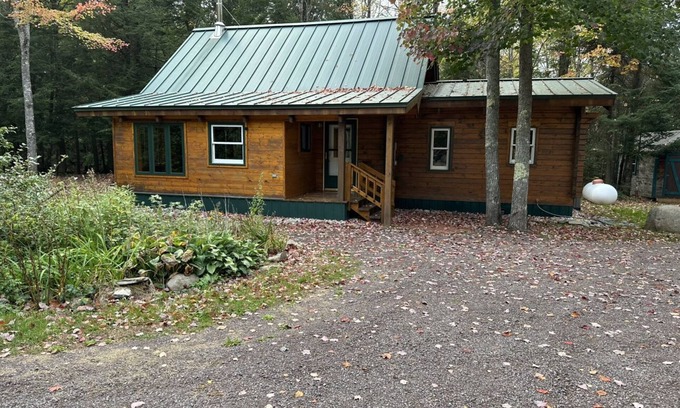 L'Anse Cabin | Private hideaway cabin, nestled in the woods with private Silver River access.