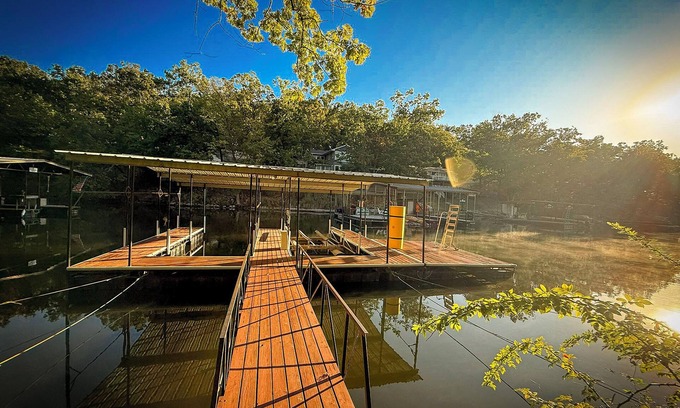 Sunrise Beach House | Private lakefront A-frame nestled in the forest on a quiet cove at Lake of the Ozarks. Sleeps 12 with 4 bedrooms, 2 baths, private dock, kayaks, coffee bar, and decks overlooking the water. Peaceful, scenic, and perfect for families or friends.