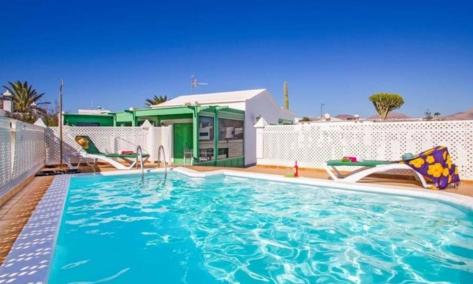 Los Pocillos Villa | R 5004 Villa Eadbald with Comfortable Seating Area, Dining Facilities & Air Conditioning.