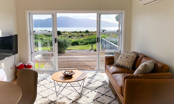 Paraparaumu Beach Apartment | RECENTLY RENOVATED PROPERTY RIGHT ON THE SAND! NEW DECK AND FREE WIFI!