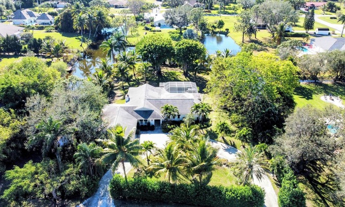 North Naples House | Relax on 1 acre in Heart of Naples, screened Pool, Hot Tub, Privacy, Fireplace