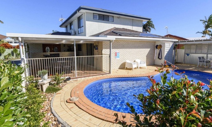 Sandstone Point House | Relax & Unwind: Poolside Paradise
